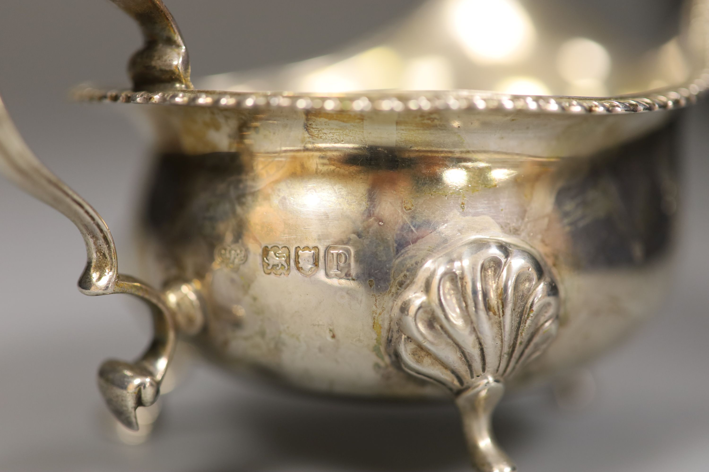A pair of George V silver sauceboats, Goldsmiths & Silversmiths Co Ltd, London, 1910, height 8cm, 12oz.